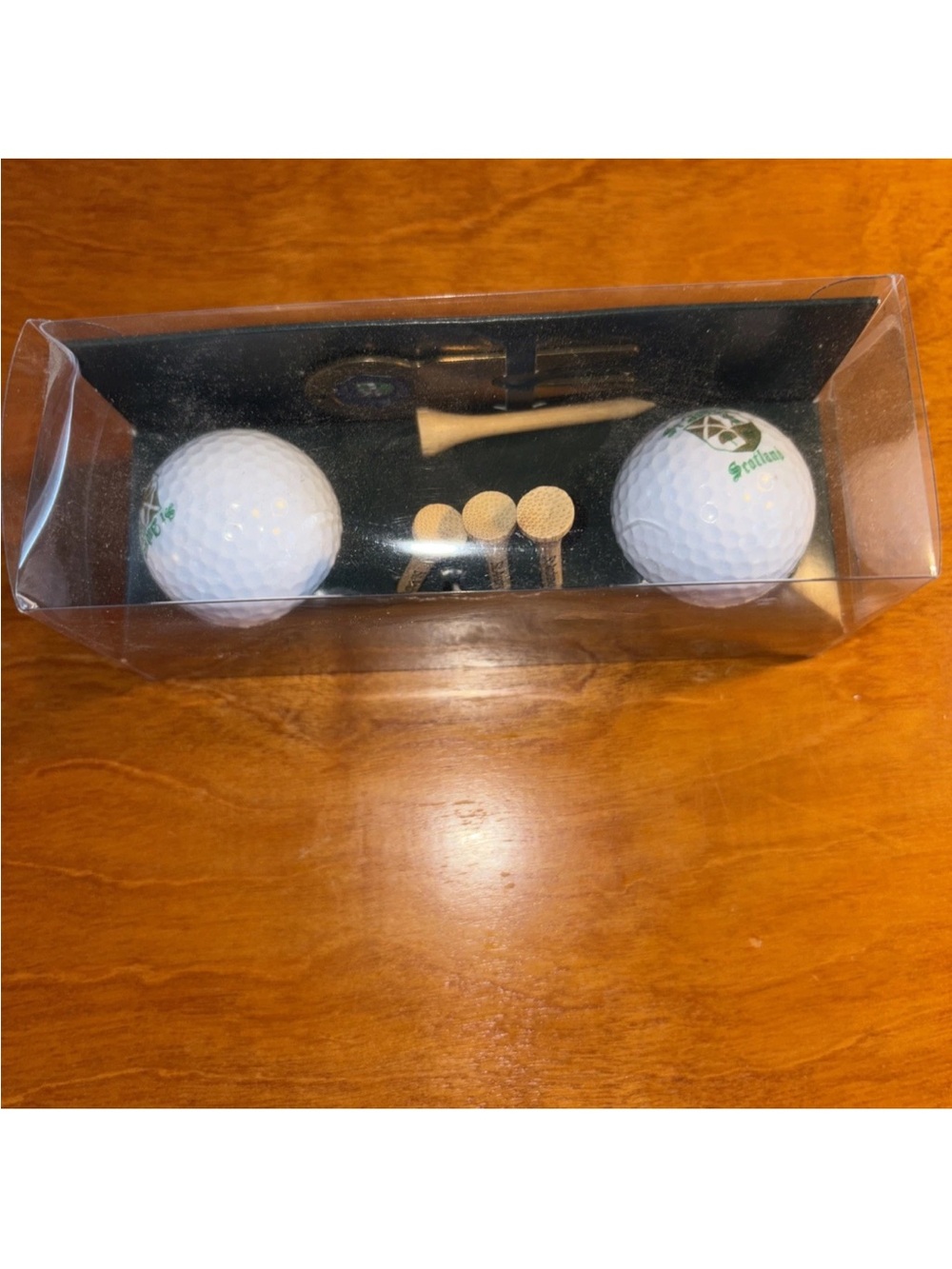 From the renowned Saint Andrew’s Golf Ball and Tee Set in White with Green Logo